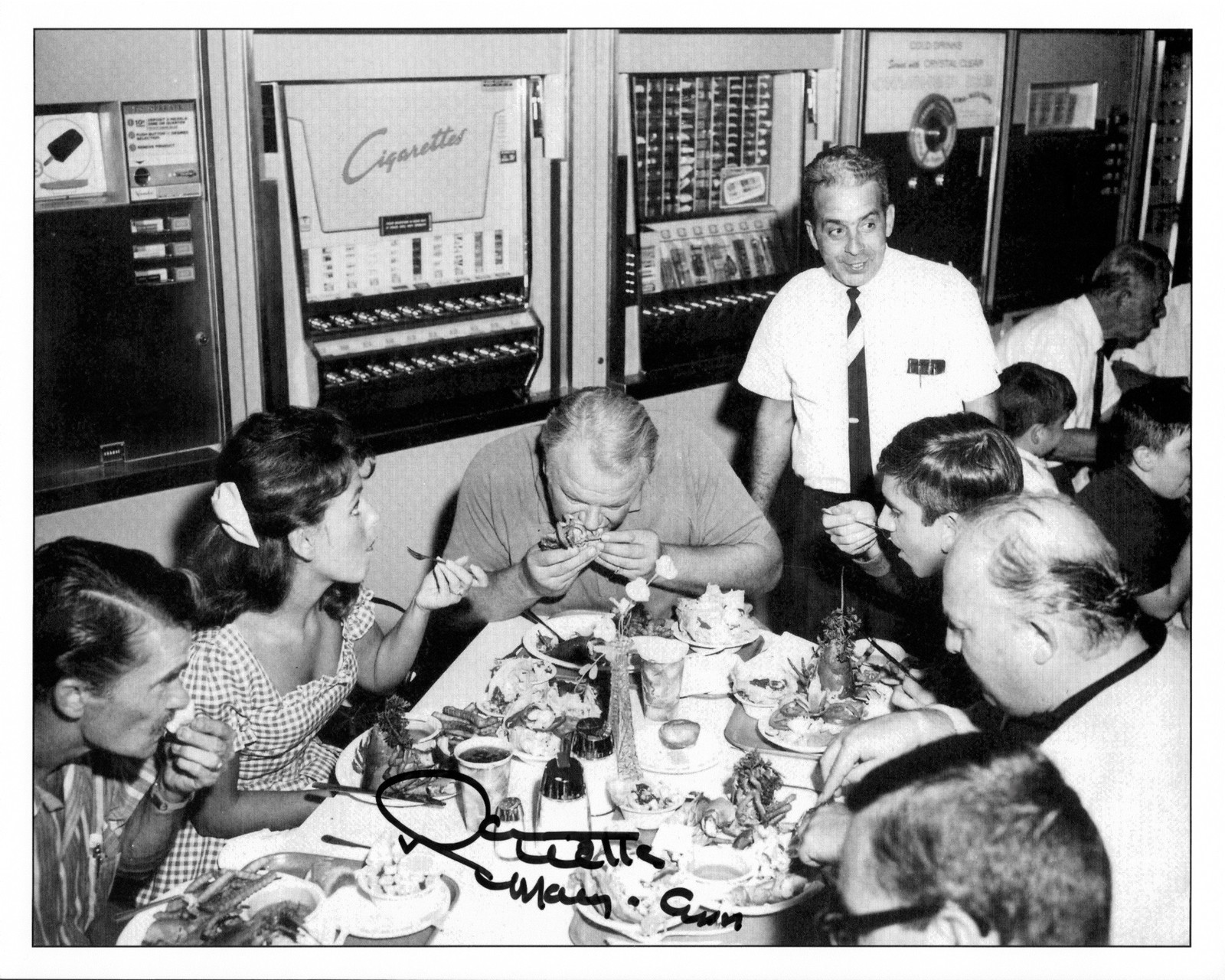 Dawn Wells, Alan Hale and Bob Denver enjoy lunch on set with crew members.